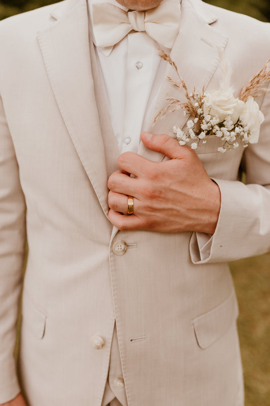 close-up of groom's tux and floral pocket by north mississippi photographer