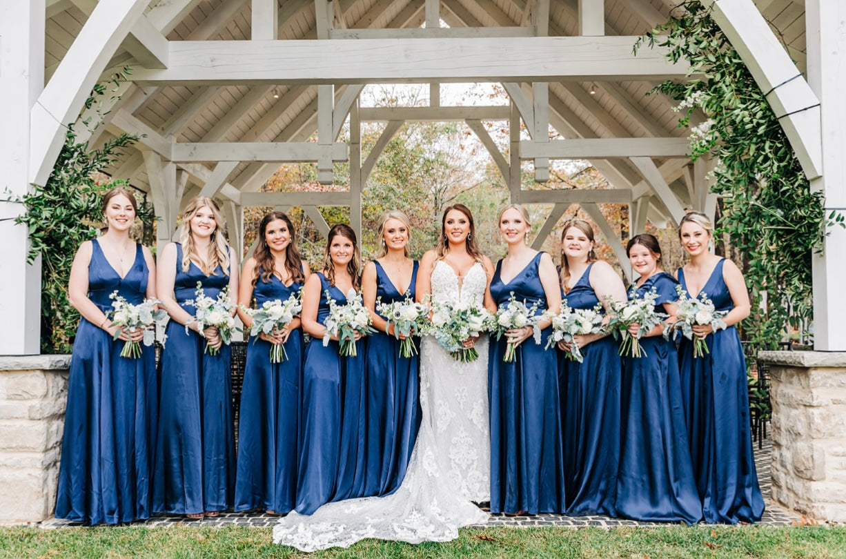 Bride and bridesmaids holding bouquets at Brookwood Venue near Oxford, MS
