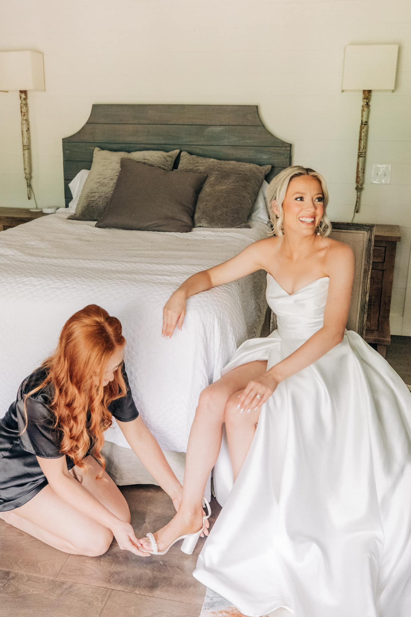 Bride getting ready in North Mississippi bridal suite with full-length mirrors at Brookwood Venue