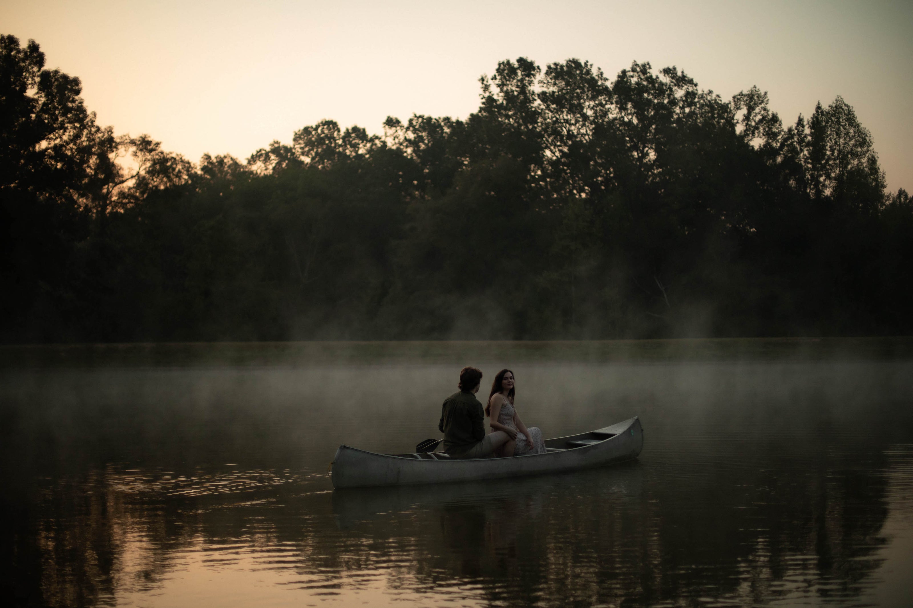 Romantic engagement session in a canoe at Brookwood Venue in North Mississippi