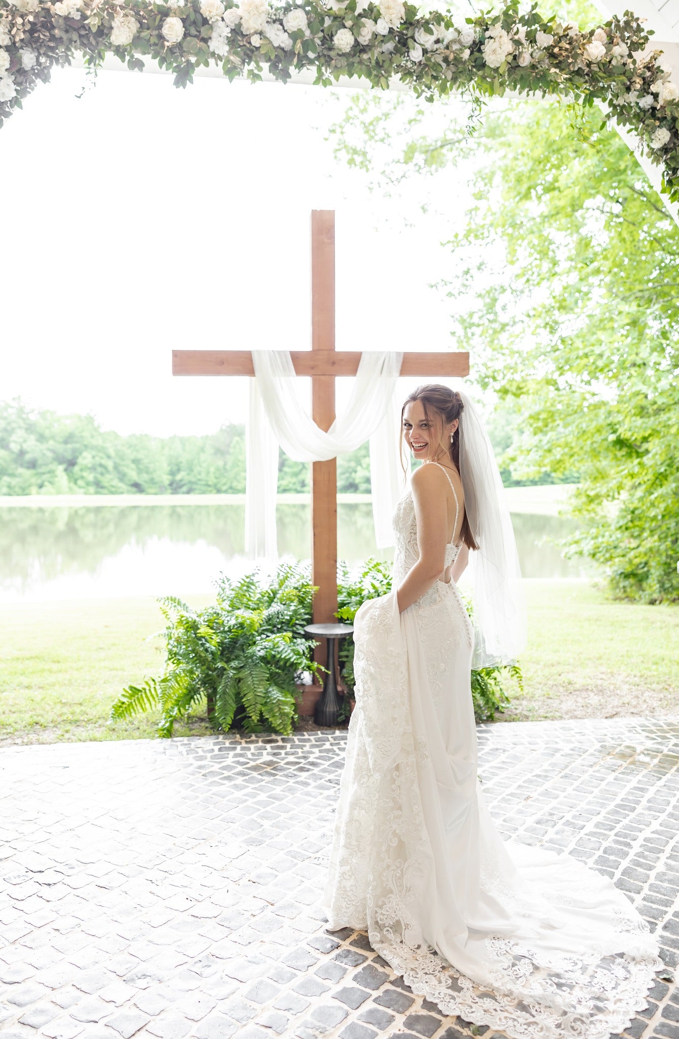 Bridal portrait with flowing veil at Brookwood Venue lakeside in North Mississippi