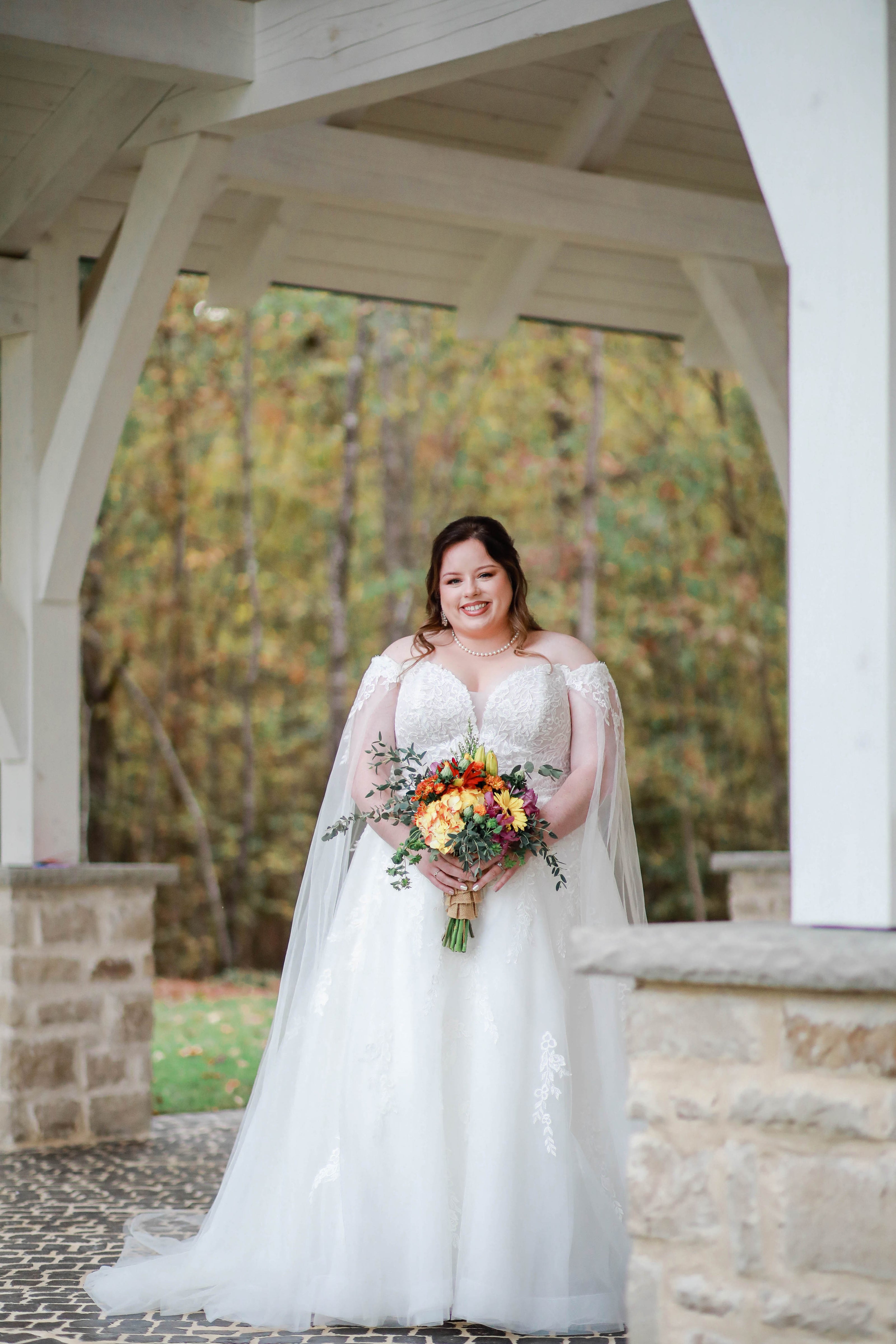 Bride standing in chapel doorway at Brookwood Venue in Bruce, Mississippi.