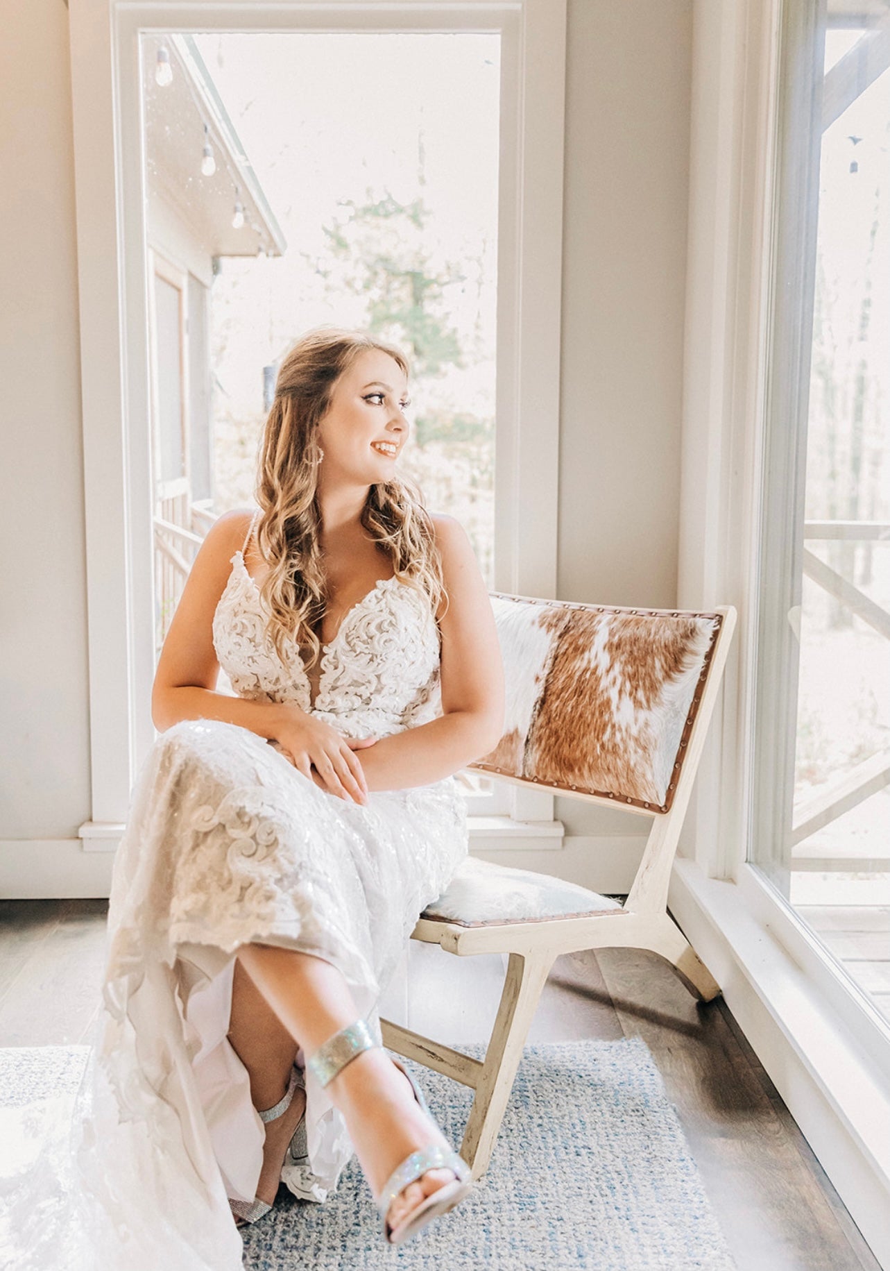 bride seated in bridal suite chair at Brookwood Venue in Bruce, Mississippi.