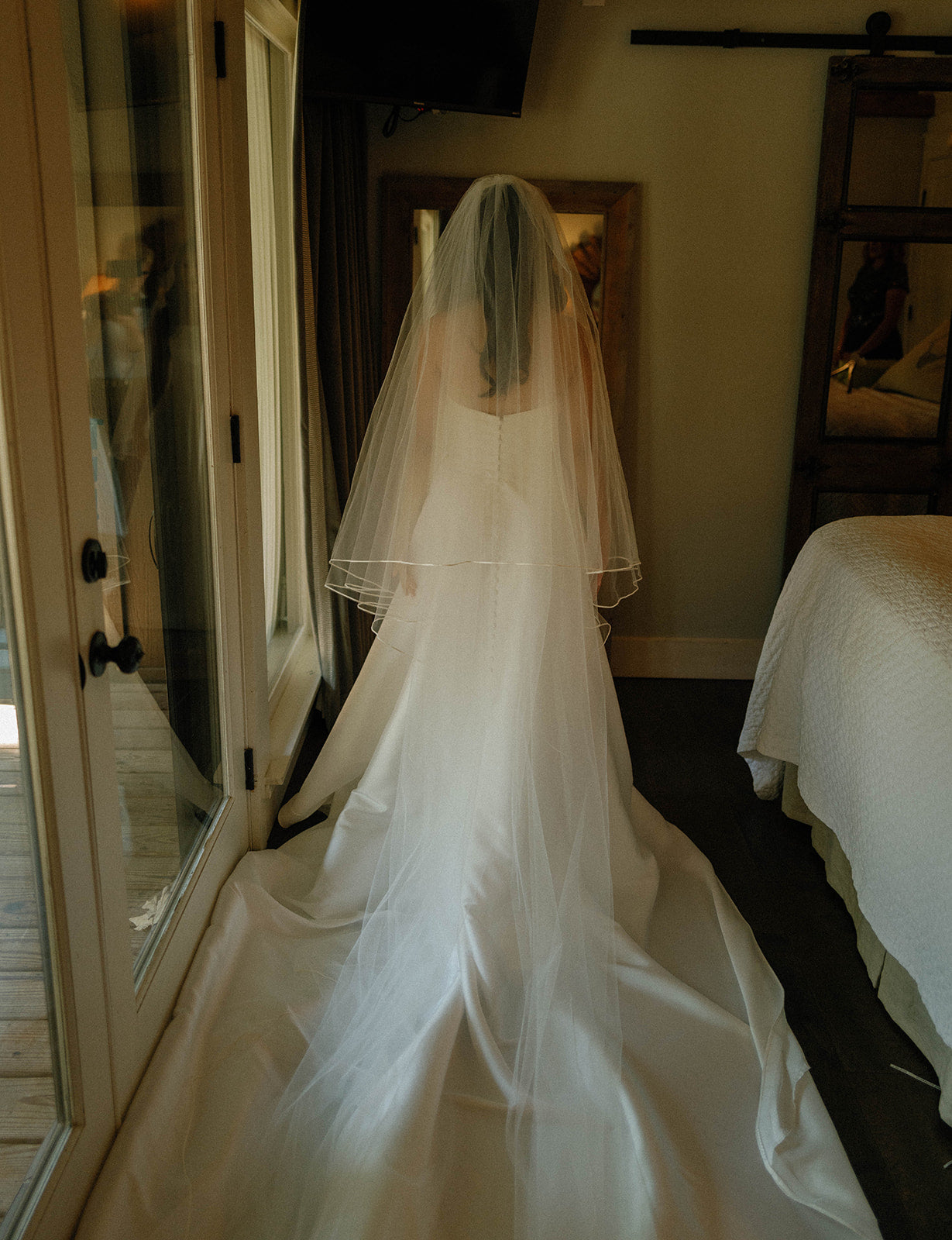 Wedding dress hanging in bridal suite at Brookwood Venue near Oxford, MS.