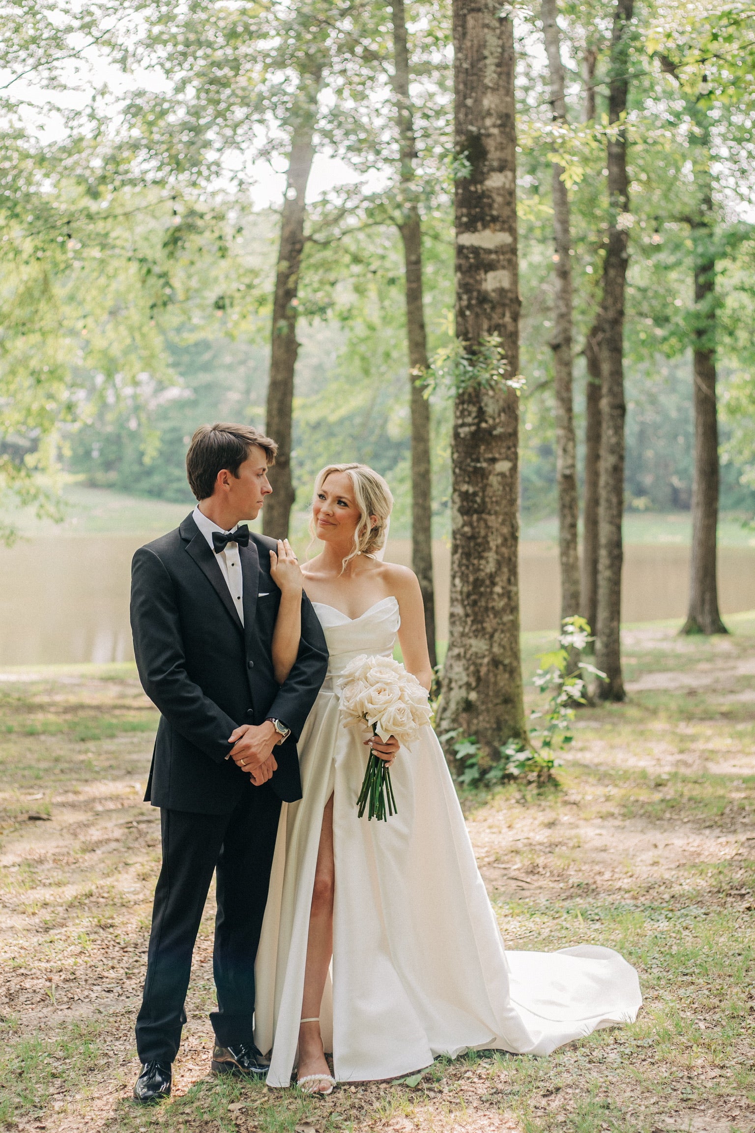Serene lake wedding photos at Brookwood Venue wedding property in Mississippi countryside