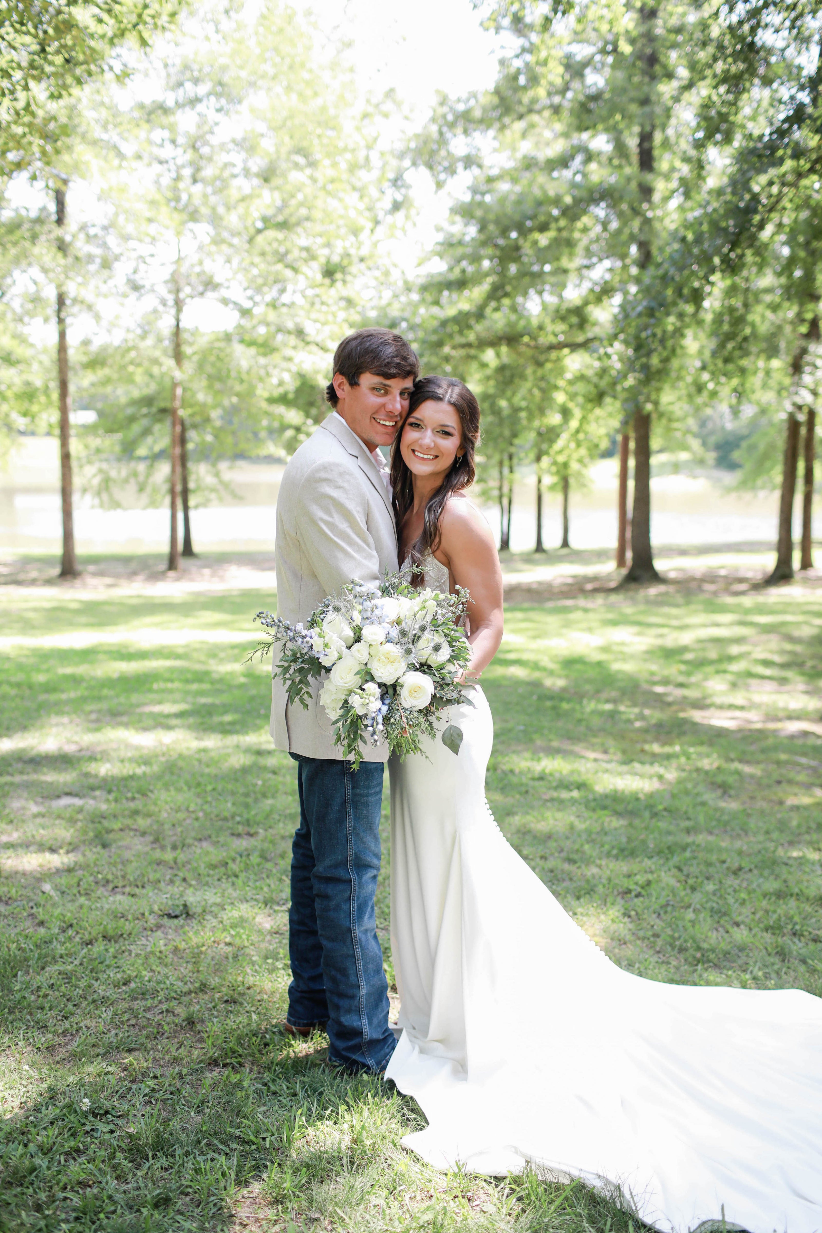 Couple embracing in woods at Brookwood Venue near Oxford, MS