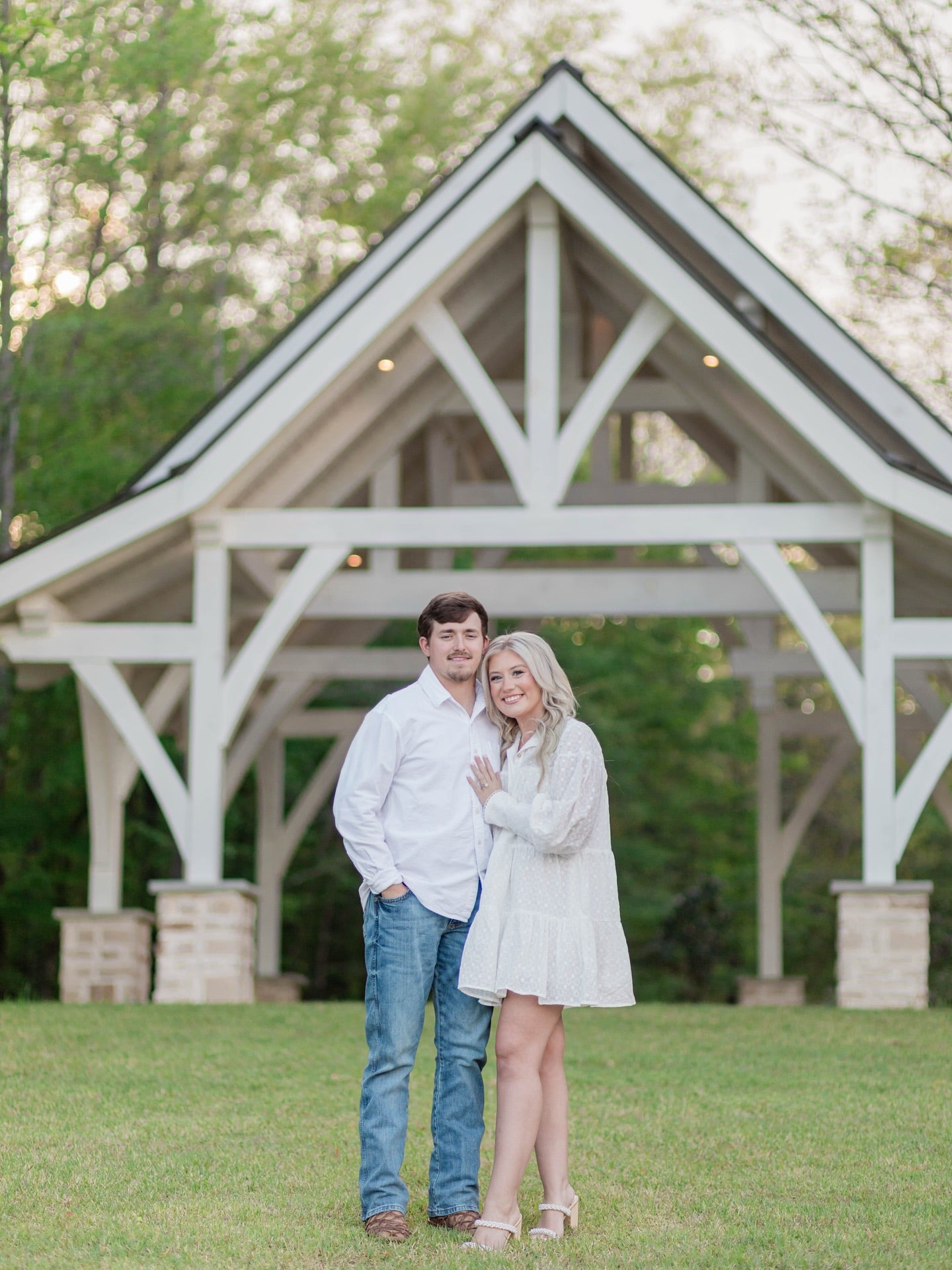Romantic engagement session on dock at Brookwood Venue in North Mississippi