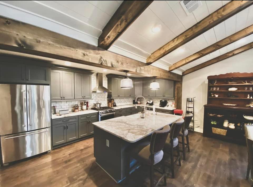 Dining area inside rural North Mississippi Airbnb with family-style table and natural light
