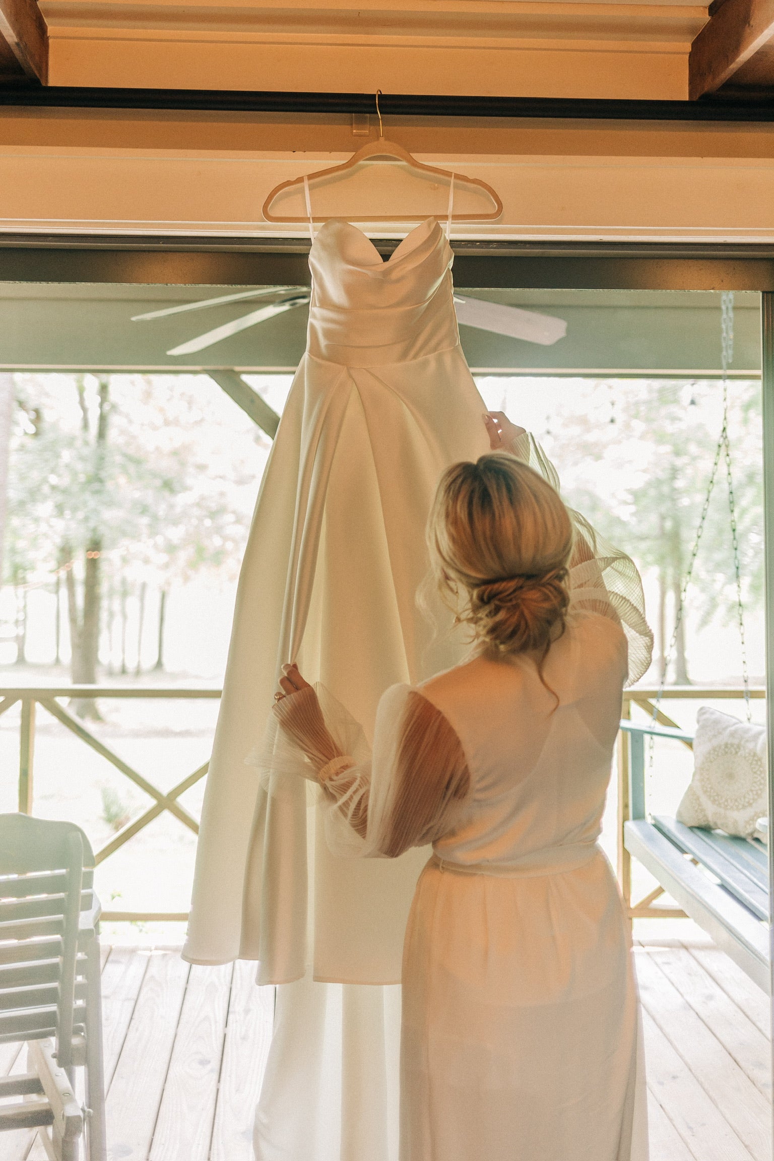 Wedding dress hanging in bridal suite at Brookwood Venue near Oxford, MS.