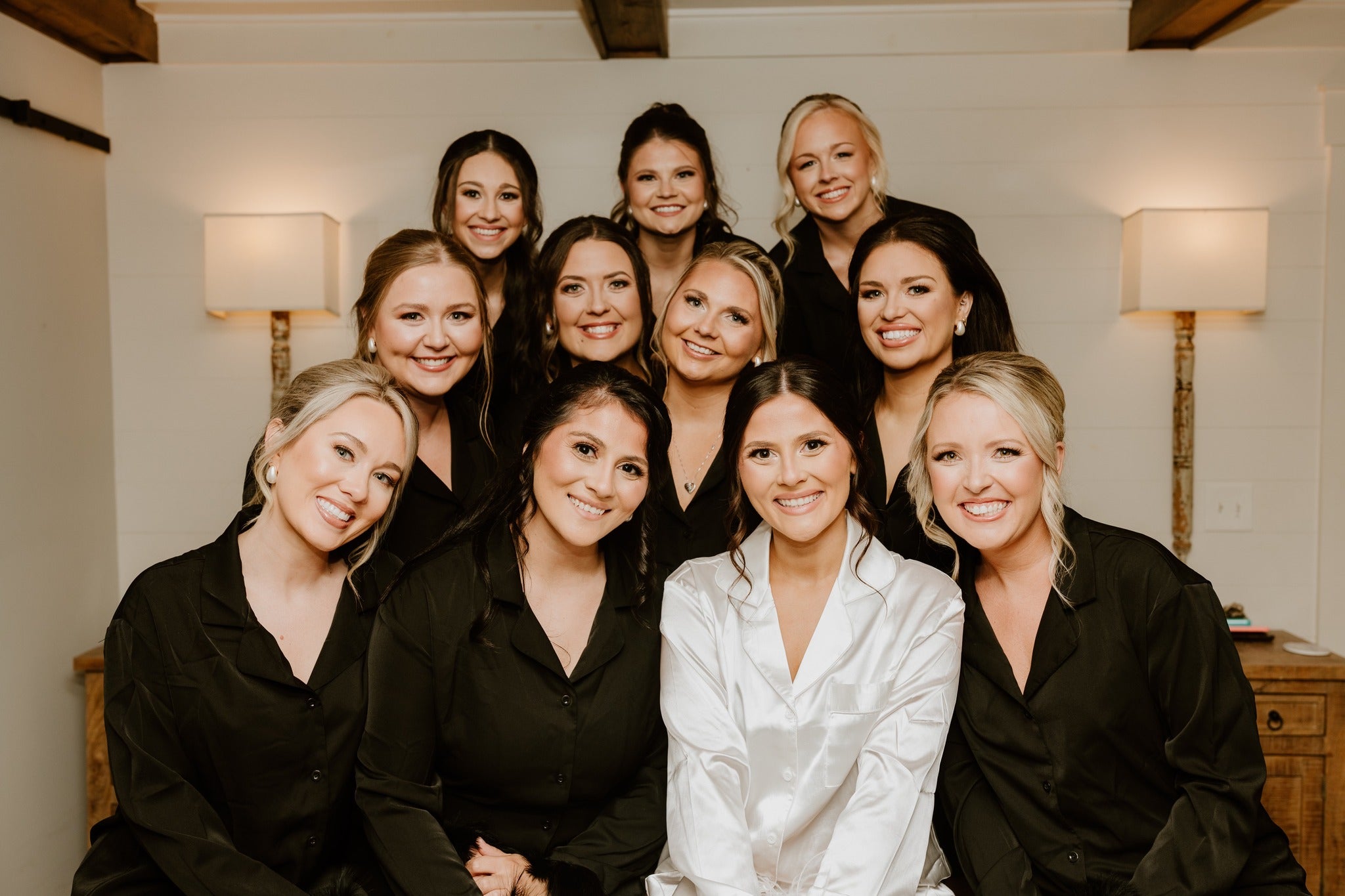 Bride laughing with family in intimate Brookwood Venue bridal suite before ceremony, North Mississippi.