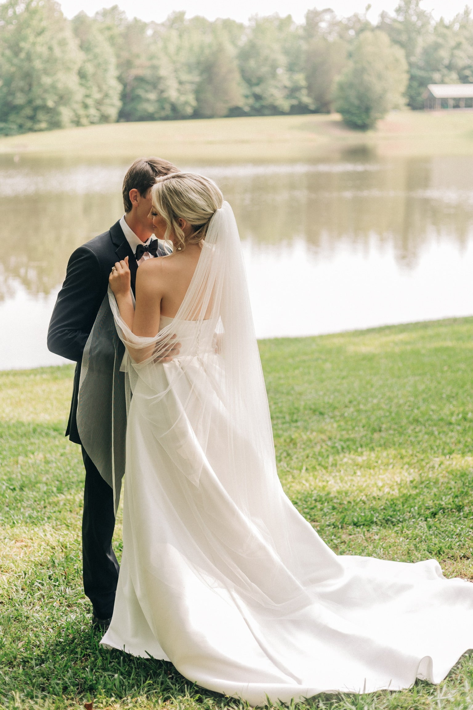 Bride and groom dancing together outdoors at Brookwood Venue in North Mississippi