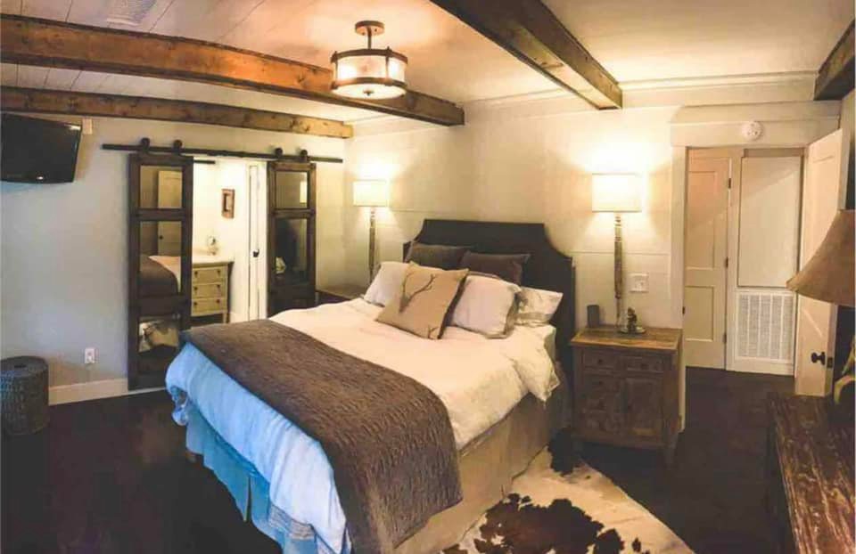 Morning light streaming into lakeside Airbnb with lake reflections, North Mississippi.