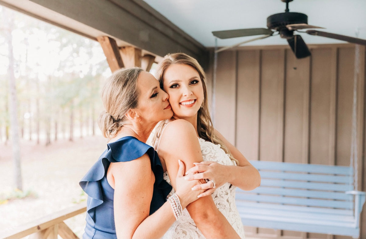 Bride and mom emotional moment during wedding prep at Brookwood Venue.