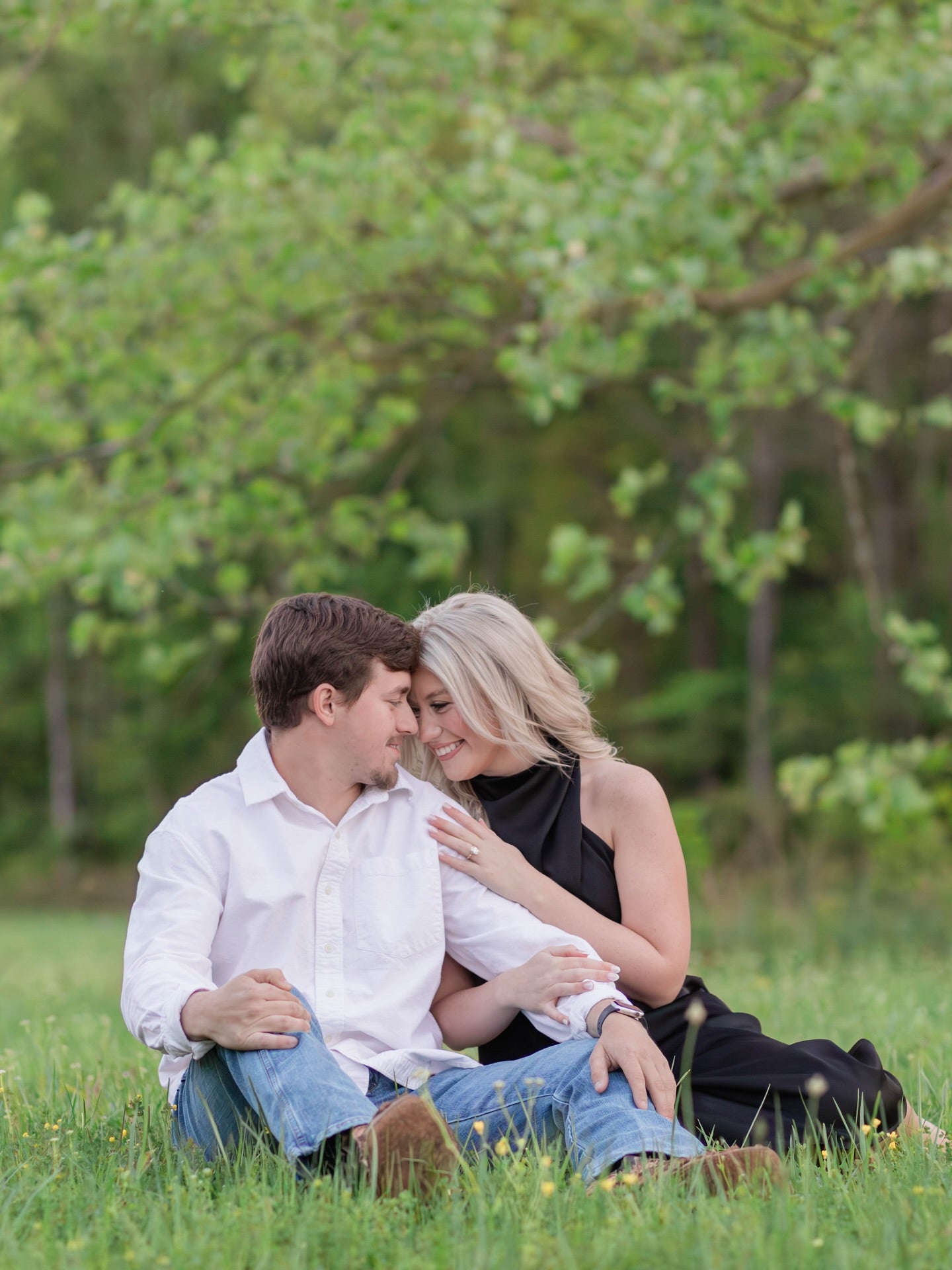 Outdoor engagement portrait session at Brookwood Venue, Bruce, Mississippi, with forrest background