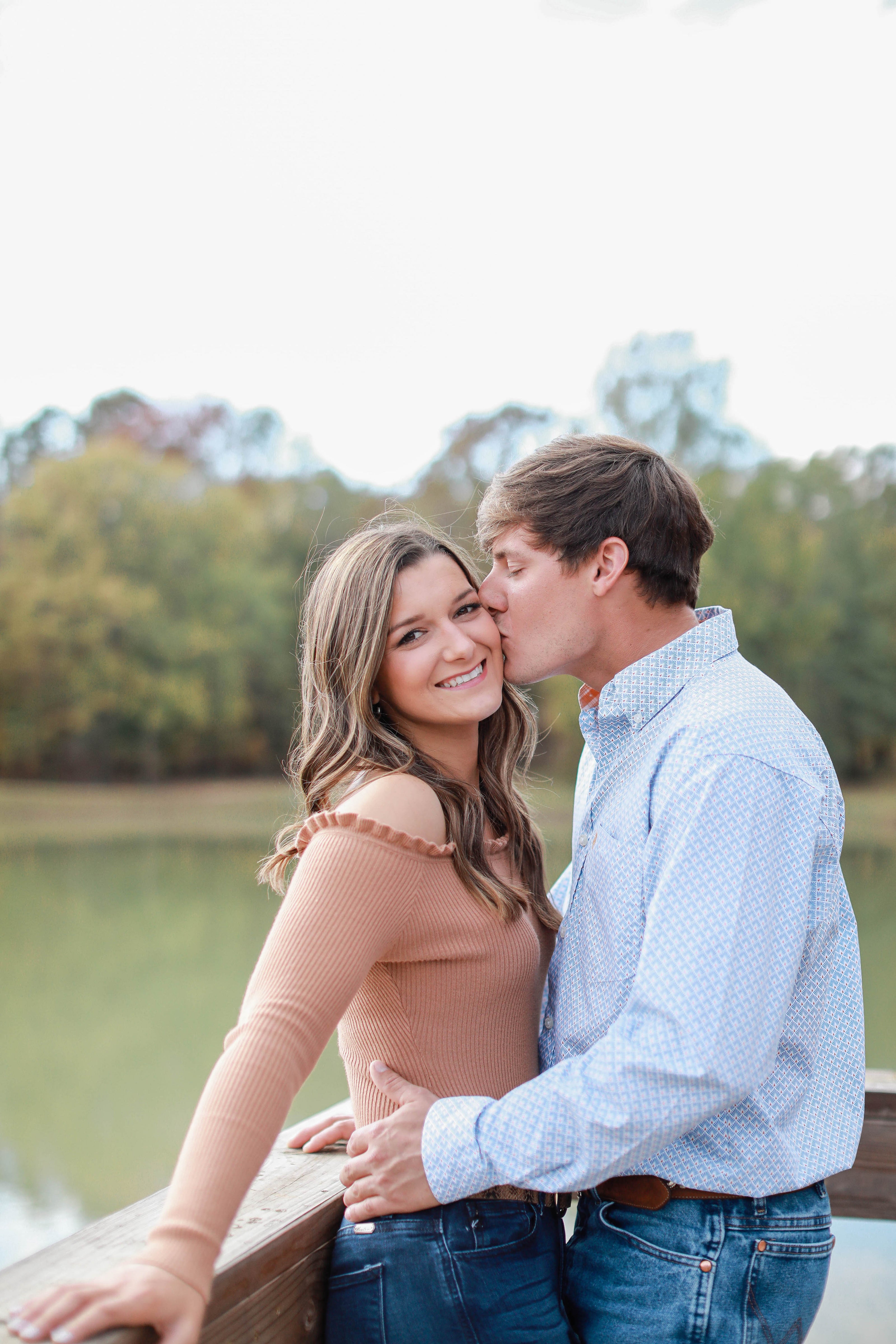 Golden hour engagement portraits at Brookwood Venue in Mississippi countryside.