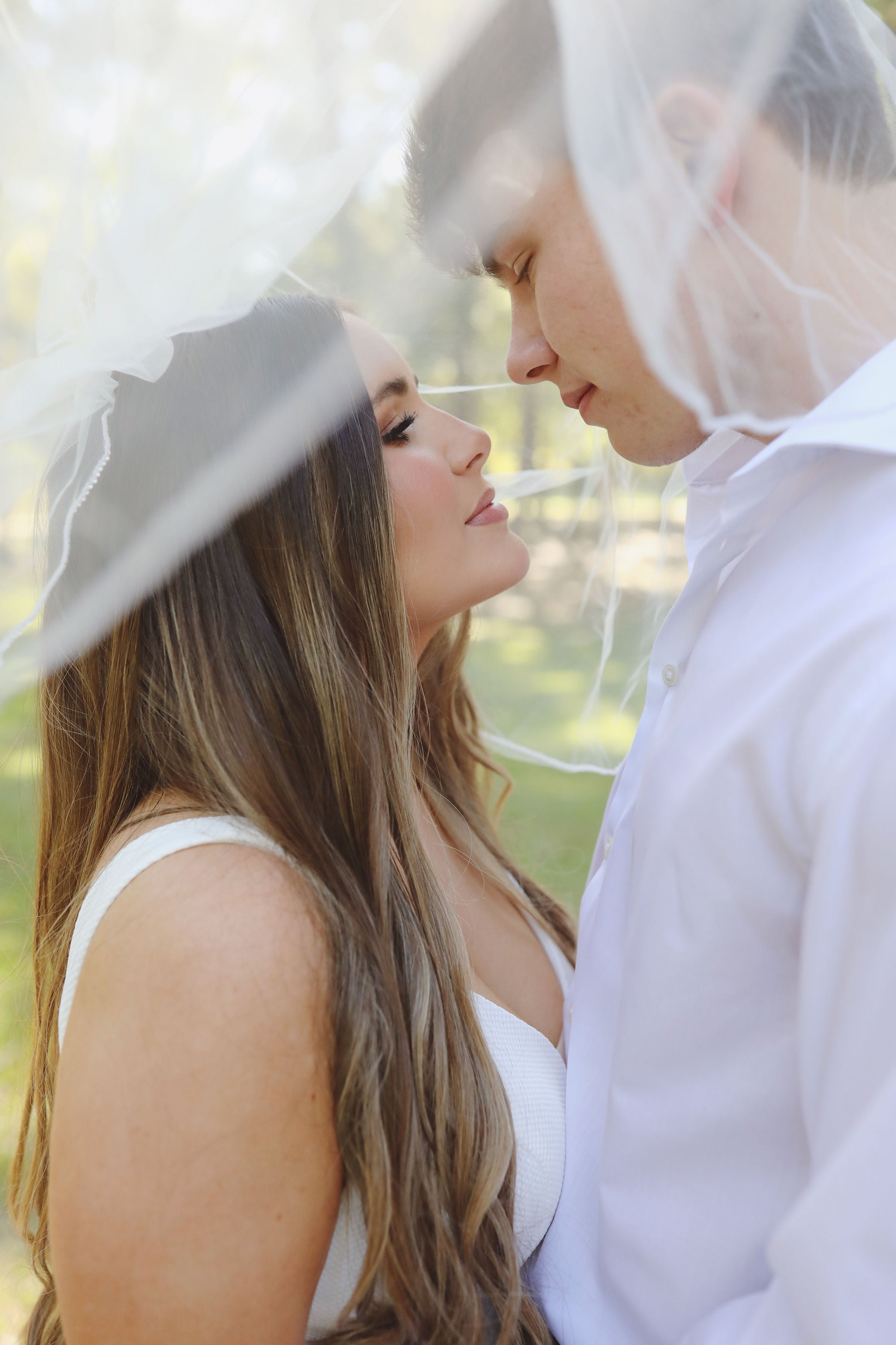 Bride and groom veil wedding photo at Brookwood Venue near Oxford, Mississippi.