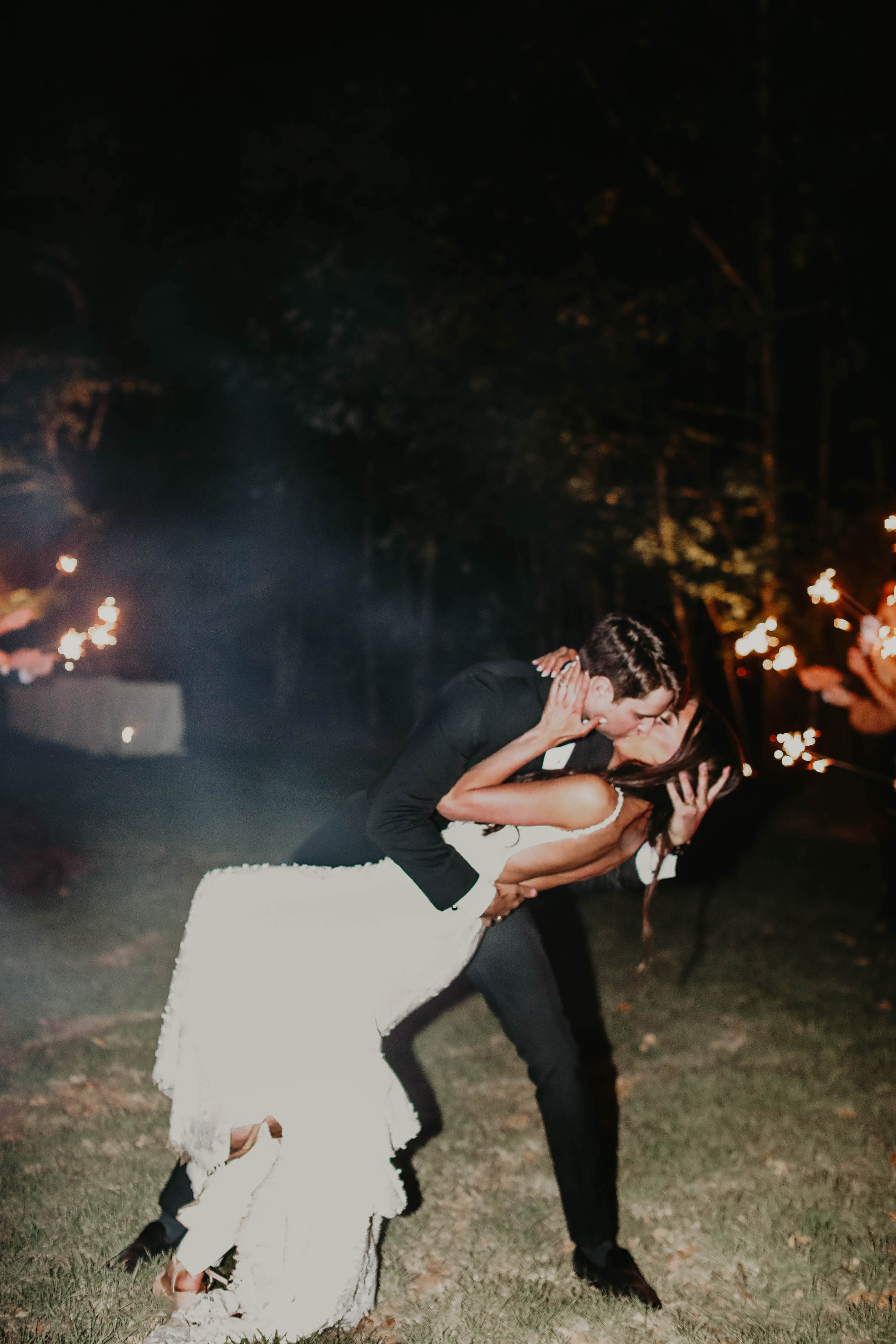 sparkler wedding exit with groom dipping bride for a kiss outside of Oxford, MS.