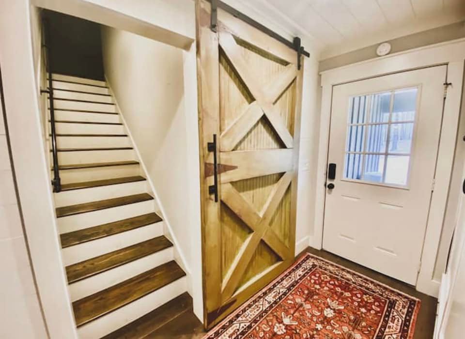 stairs leading up to a cozy third bedroom in luxury cabin on 120 acres utside of Oxford, Mississippi