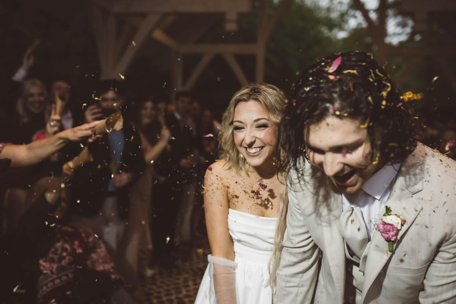 Couple leaving ceremony with confetti at Brookwood Venue, North Mississippi wedding