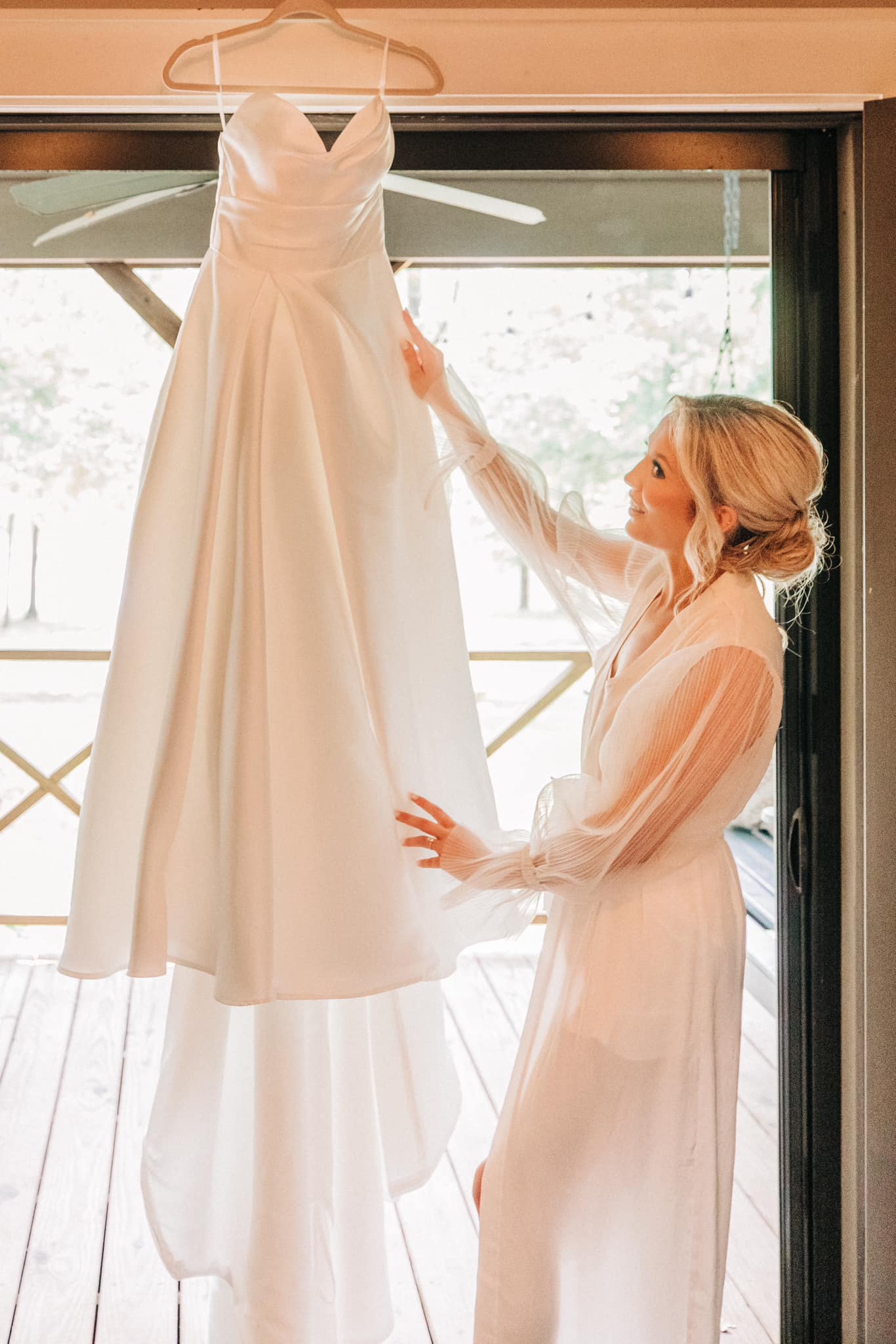 Detail shot of wedding gown hanging in bridal suite at Brookwood Venue, North Mississippi.