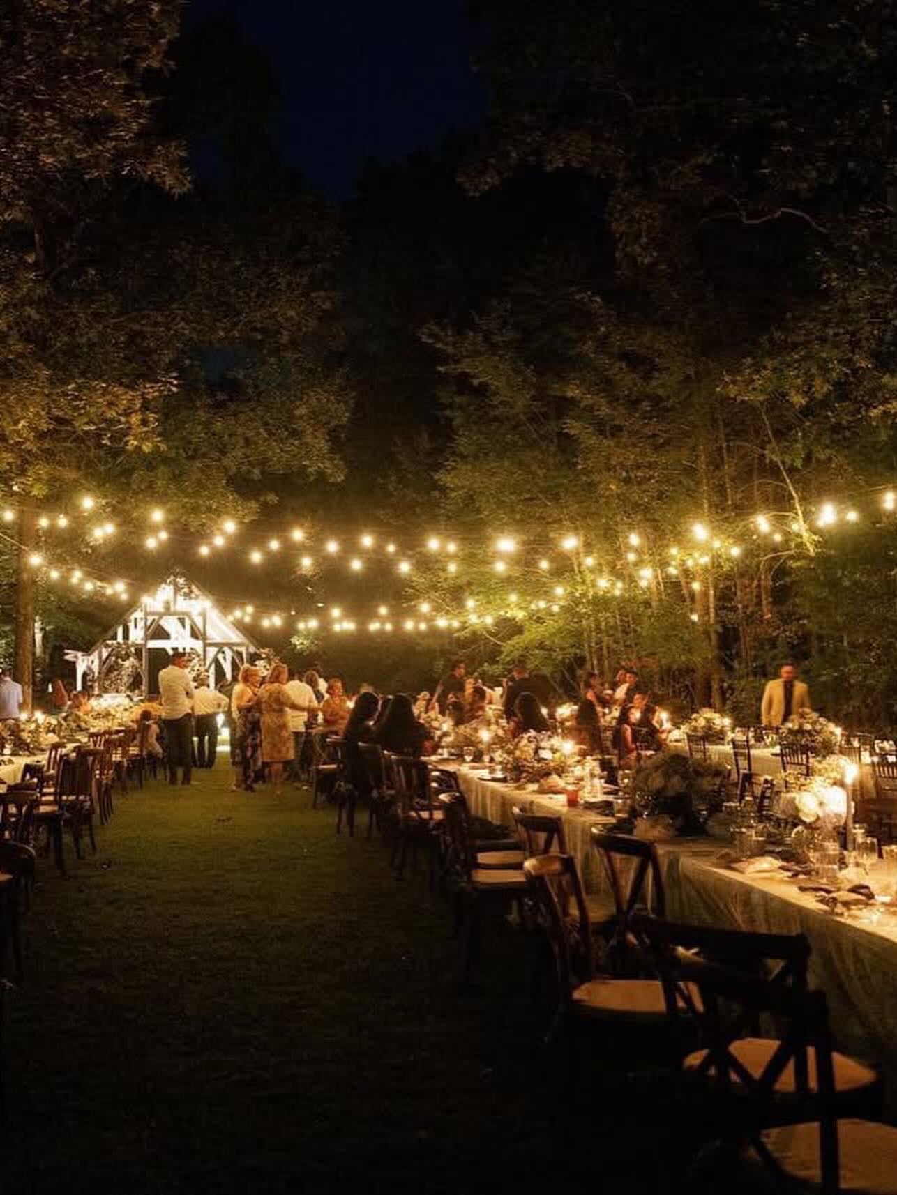 Nighttime wedding reception with glowing lights at Brookwood Venue.