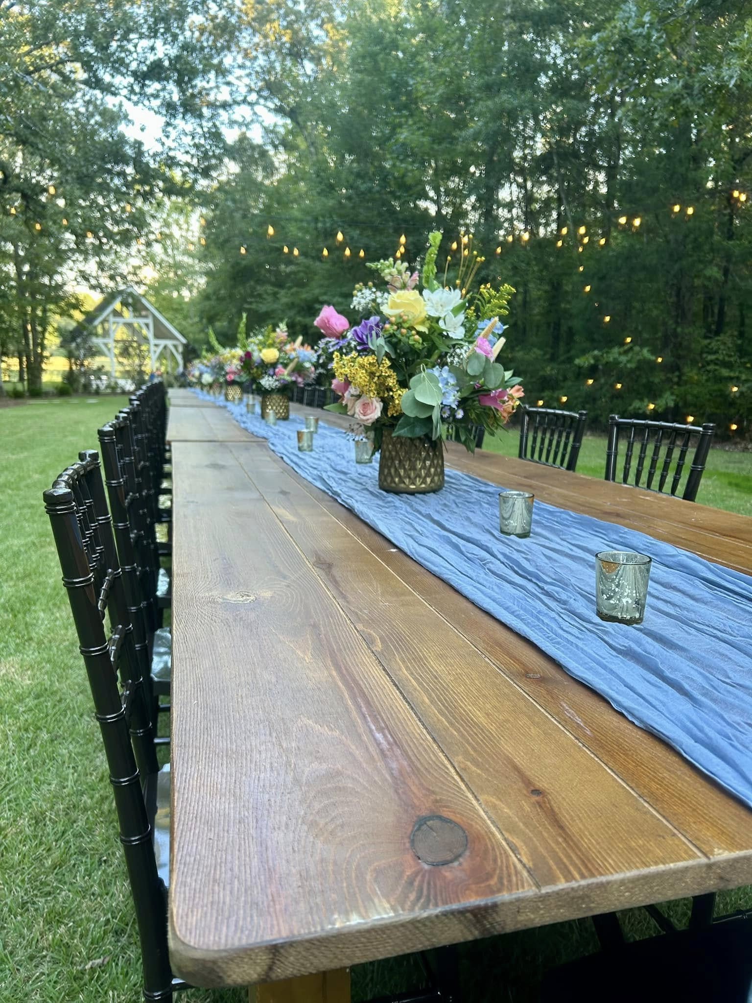 Natural outdoor wedding setting surrounded by trees at Brookwood Venue in North Mississippi